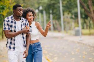 Date couple man and women valentine day. African black lover at park outdoors summer season vintage color tone photo