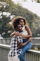 Date couple man and women valentine day. African black lover at park outdoors summer season vintage color tone photo