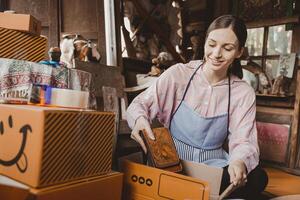 woman packing products order box send to customer freelance work for own business at home vintage tone photo