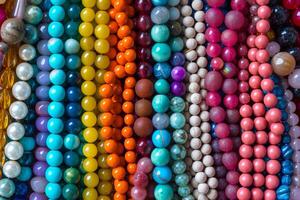 AI generated Close up of a pile of shiny colorful beads. Generative AI photo