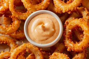 AI generated Fried crispy onion rings with dipping sauce. Generative AI photo