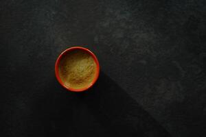 Flat lay of coffee mug on the black table photo