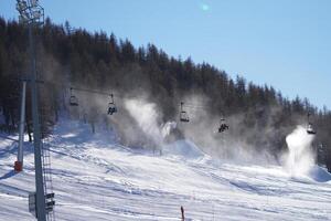 Winter landscape in mountains with funiculars photo