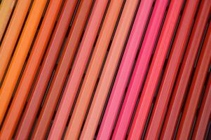 Row of colored pencils close up, beautiful color gradient. Decorative background. photo