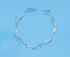 Water Splash Forming Circular Shape Against Sky Blue Background photo