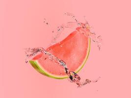 Watermelon Wedge with Splashing Water on Pastel Red Background photo