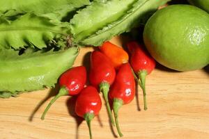 Winged bean on wooden background, Organic vegetable from local market in Southeast Asia. Healthy Green Vegetables photo