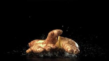 Fresh ginger falls on the table. Filmed on a high-speed camera at 1000 fps. High quality FullHD footage video