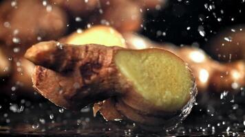 A knife cuts through fresh ginger. Filmed on a high-speed camera at 1000 fps. High quality FullHD footage video