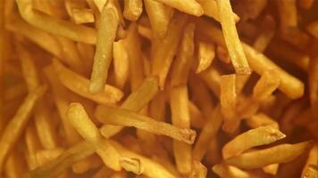 French fries fly up and fall down. Filmed on a high-speed camera at 1000 fps. High quality FullHD footage video