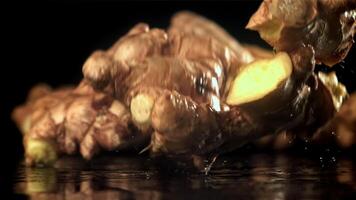 Fresh ginger falls on the table. Filmed on a high-speed camera at 1000 fps. High quality FullHD footage video