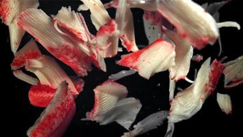 Fresh crab sticks fly up and fall down. Filmed on a high-speed camera at 1000 fps. High quality FullHD footage video