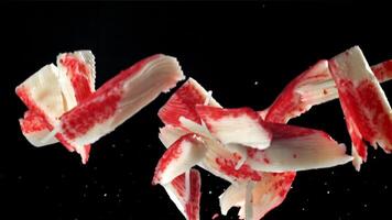 Fresh crab sticks fly up and fall down. Filmed on a high-speed camera at 1000 fps. High quality FullHD footage video