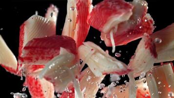 Fresh crab sticks fly up and fall down. Filmed on a high-speed camera at 1000 fps. High quality FullHD footage video