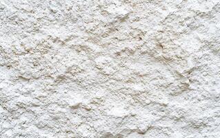 AI generated Warm white rough grainy stone texture background photo