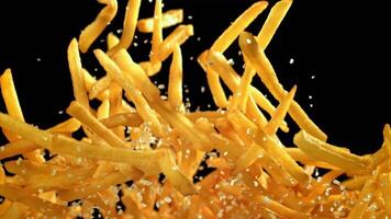 French fries fly up and fall down. Filmed on a high-speed camera at 1000 fps. High quality FullHD footage video