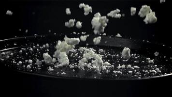 Fresh cottage cheese falls into the plate. Filmed on a high-speed camera at 1000 fps. High quality FullHD footage video