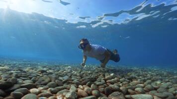 soldier swims underwater in the sea video