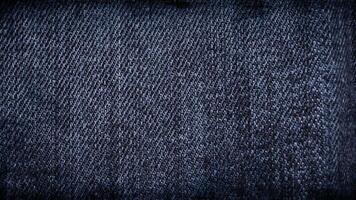 Stylish dark blue denim texture stop-motion background loop with scratches, worn details, and fashionable close-ups, perfect for a trendy and grunge inspired fashion or design project. video