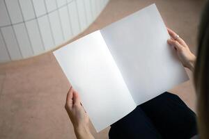 A book with a blank empty cover mockup template photo