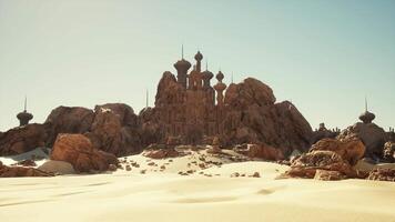 A desert scene with rocks and a building in the background video