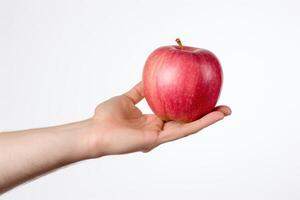 AI generated a hand holding an apple on a white background photo