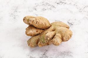 Raw ginger root fot cooking photo