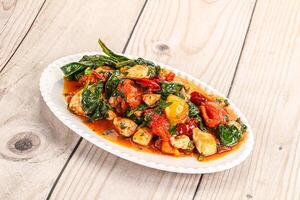 Chicken with tomato and spinach photo