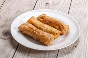 Traditional crispy fried stuffed springroll photo