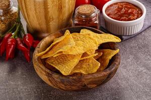 Mexican corn nachos chips with salsa photo