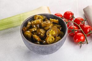 Sliced canned jalapeno pepper photo