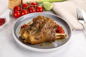 Baked Lamb shank with bone photo