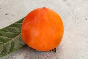 Fresh ripe sweet juicy persimmon photo