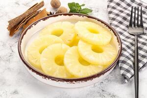 Sweet Canned pineapple in the bowl photo