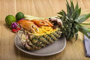 Rice with seafood in pineapple photo