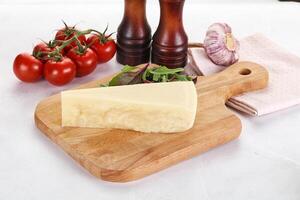 Piece Italian hard parmesan cheese photo