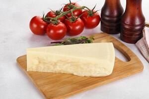 Piece Italian hard parmesan cheese photo