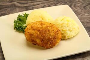 Crispy chicken cutlet with mashed potato photo