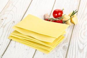 Uncooked raw Lasagna dry sheets photo