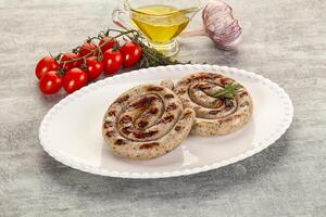 Grilled natural spiral meat sausage photo