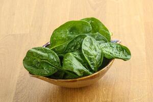 Fresh green spinach leaves in the bowl photo