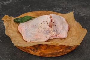 Raw chicken hip with spices photo