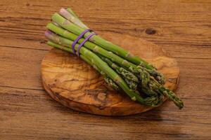 Vegan cuisine - Raw asparagus heap photo