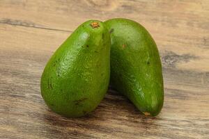 Two ripe exotic avocado vegetable photo