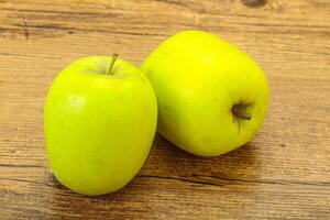 Two ripe green sweet apples photo