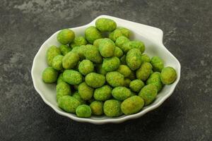 Spicy wasabi peanuts in the bowl photo