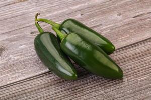 Green raw jalapeno peper heap photo