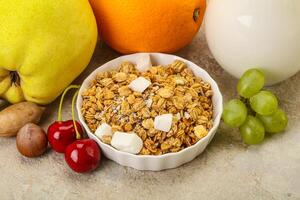 Breakfast with granola and milk photo