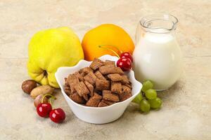 Breakfast with corn chokolate pads and milk photo