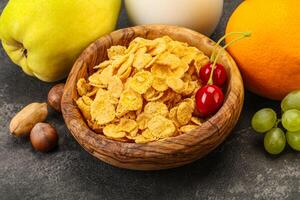 Breakfast with corn flakes and milk photo